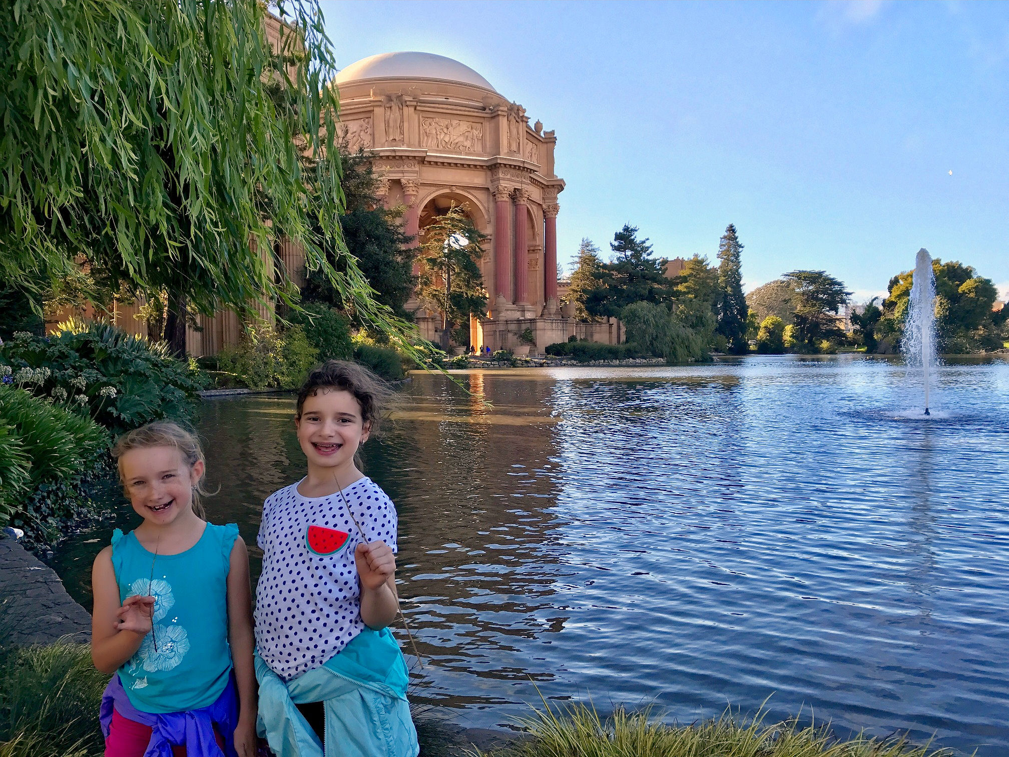 Kids posing with the Palace of Fine Arts