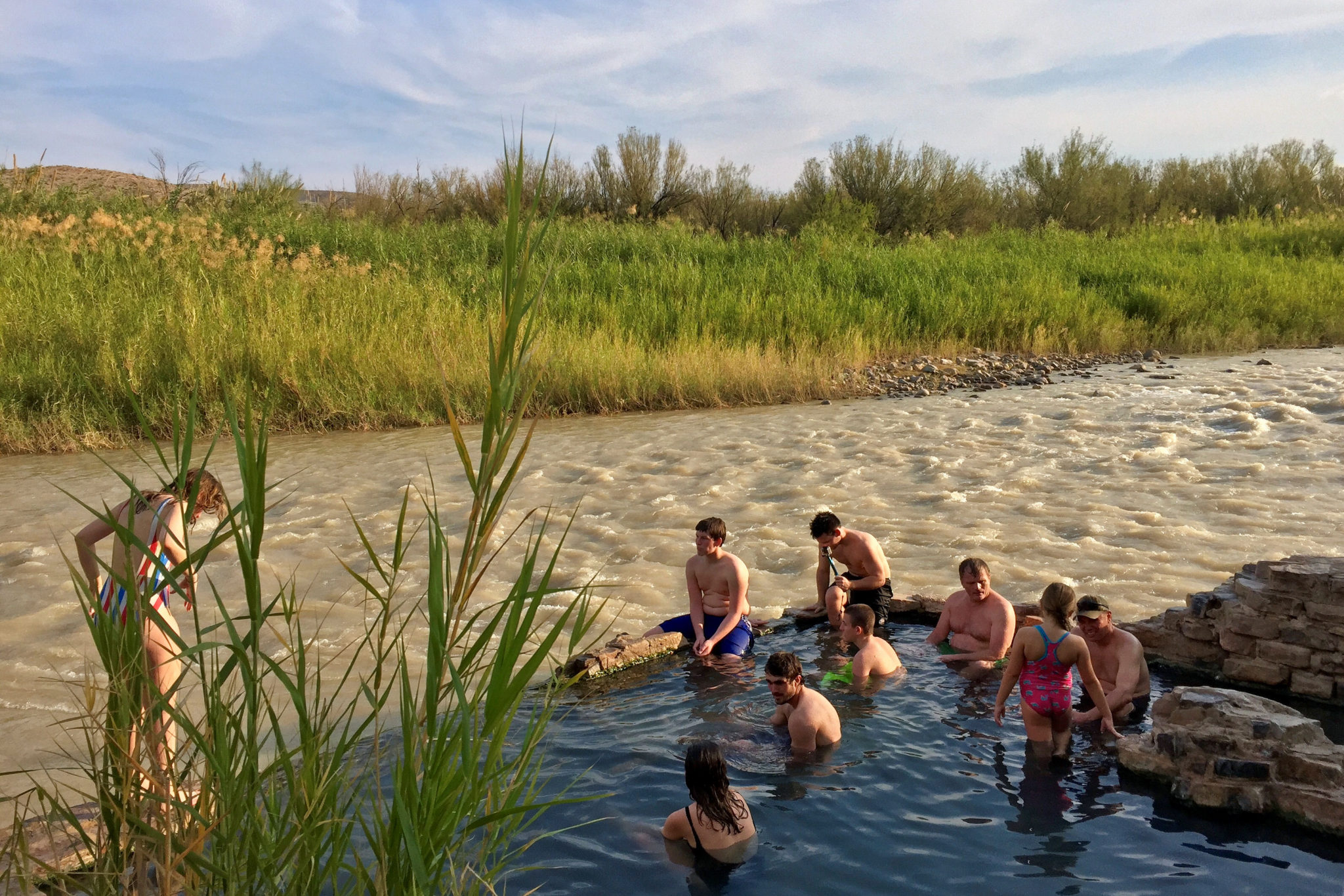 Visitors bathing in the hot springs near the Rio Grande River in Big Bend National Park