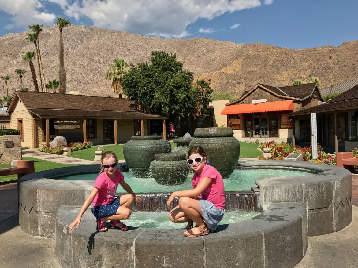 Enjoying the cool sprinkles from a small fountain in downtown Palm Springs