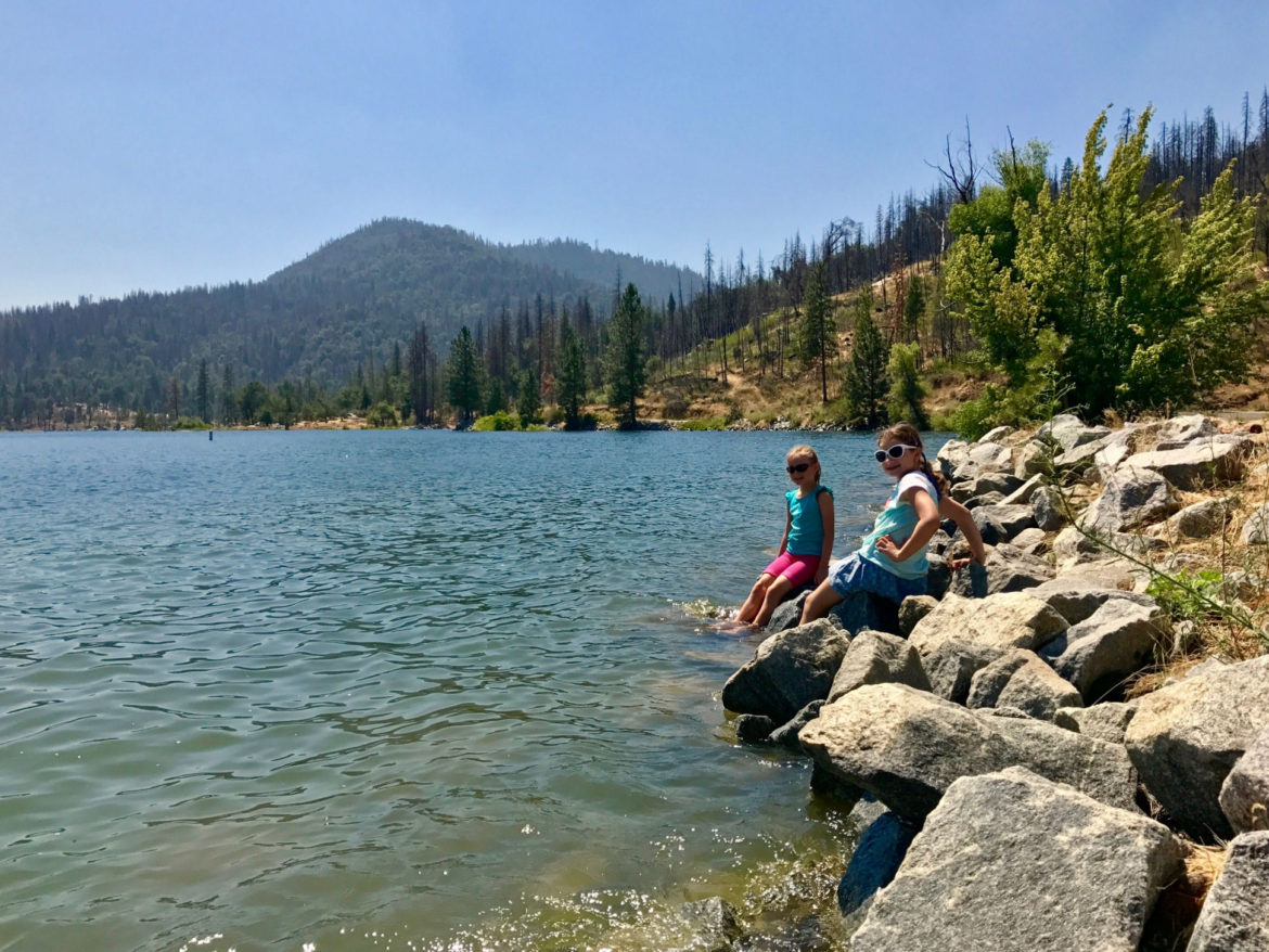 Kids enjoying the cool water of Bass Lake, California