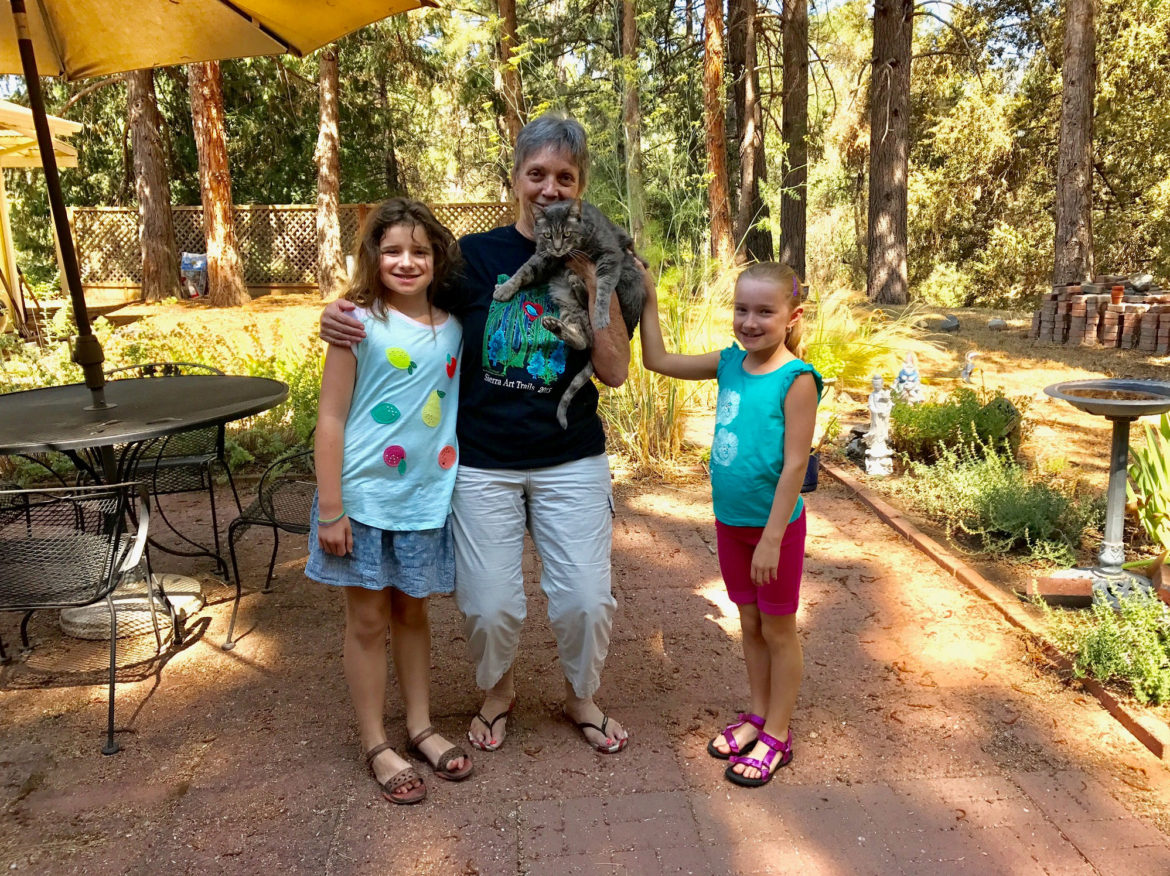 Kids posing with our lovely AirBnb host in Oakhurst, California