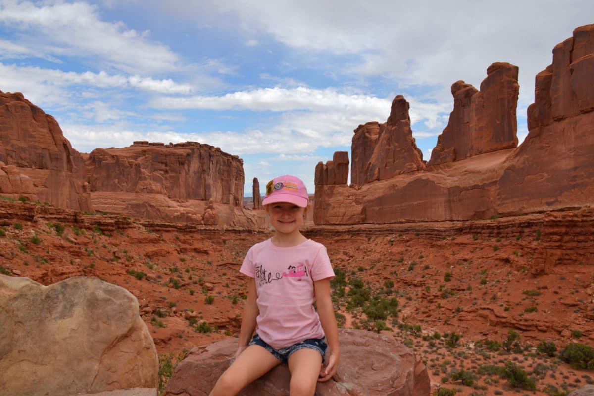 Posing with Park Avenue Trail in Arches National Park