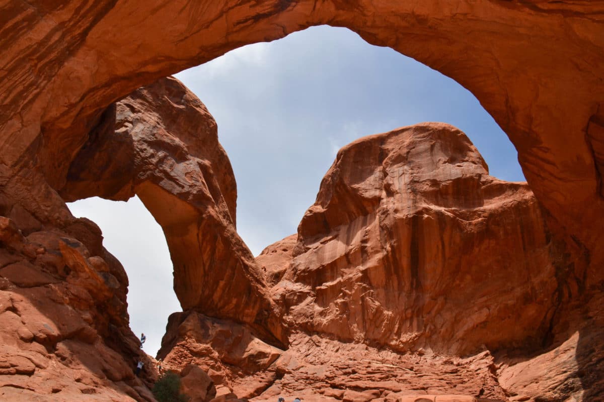 Standing under Double Arch in Arches National Park