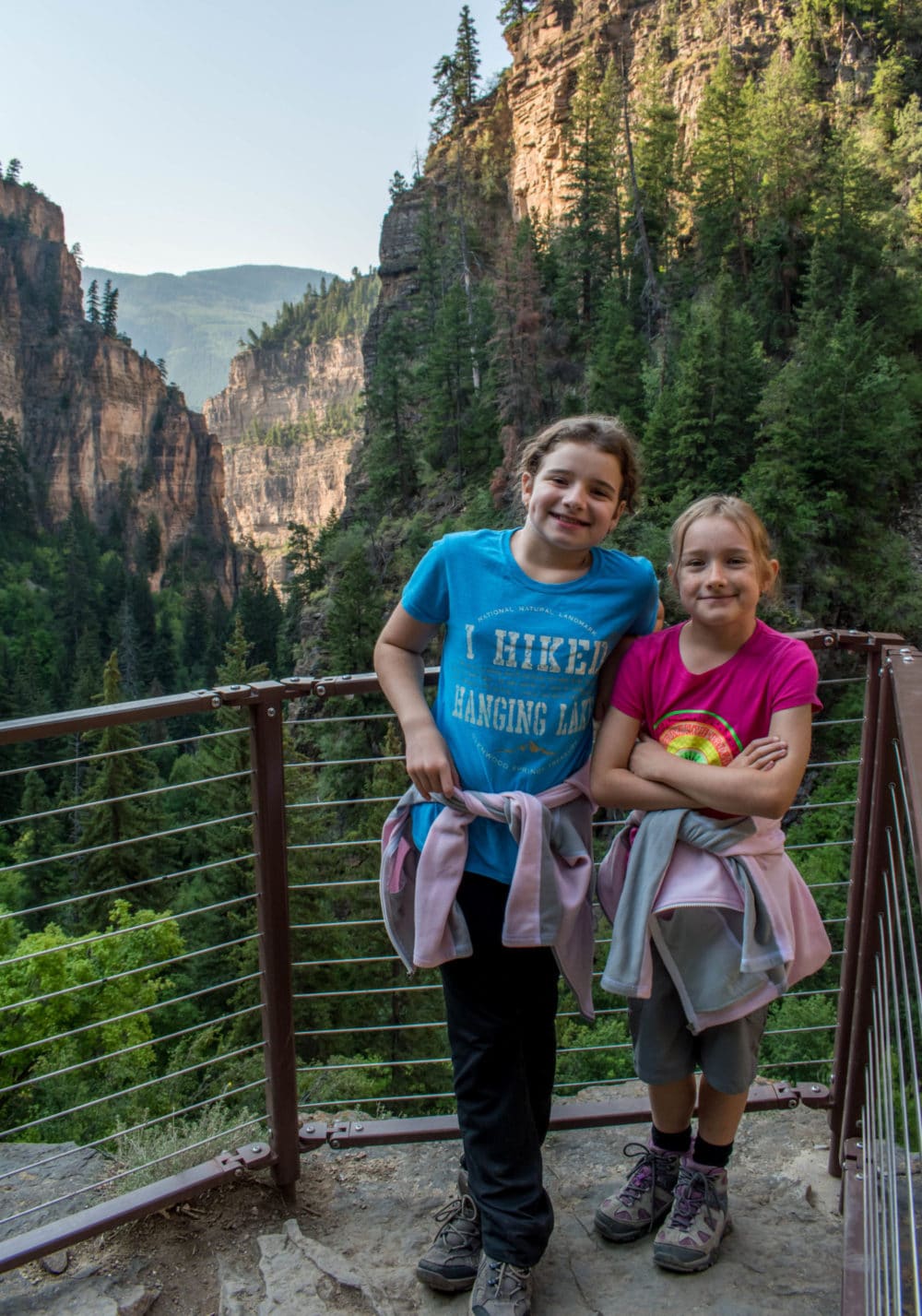 The kids posing with Glenwood Canyon