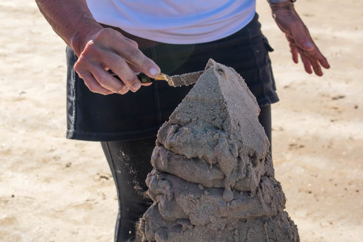 Carving the sandcastle's towers