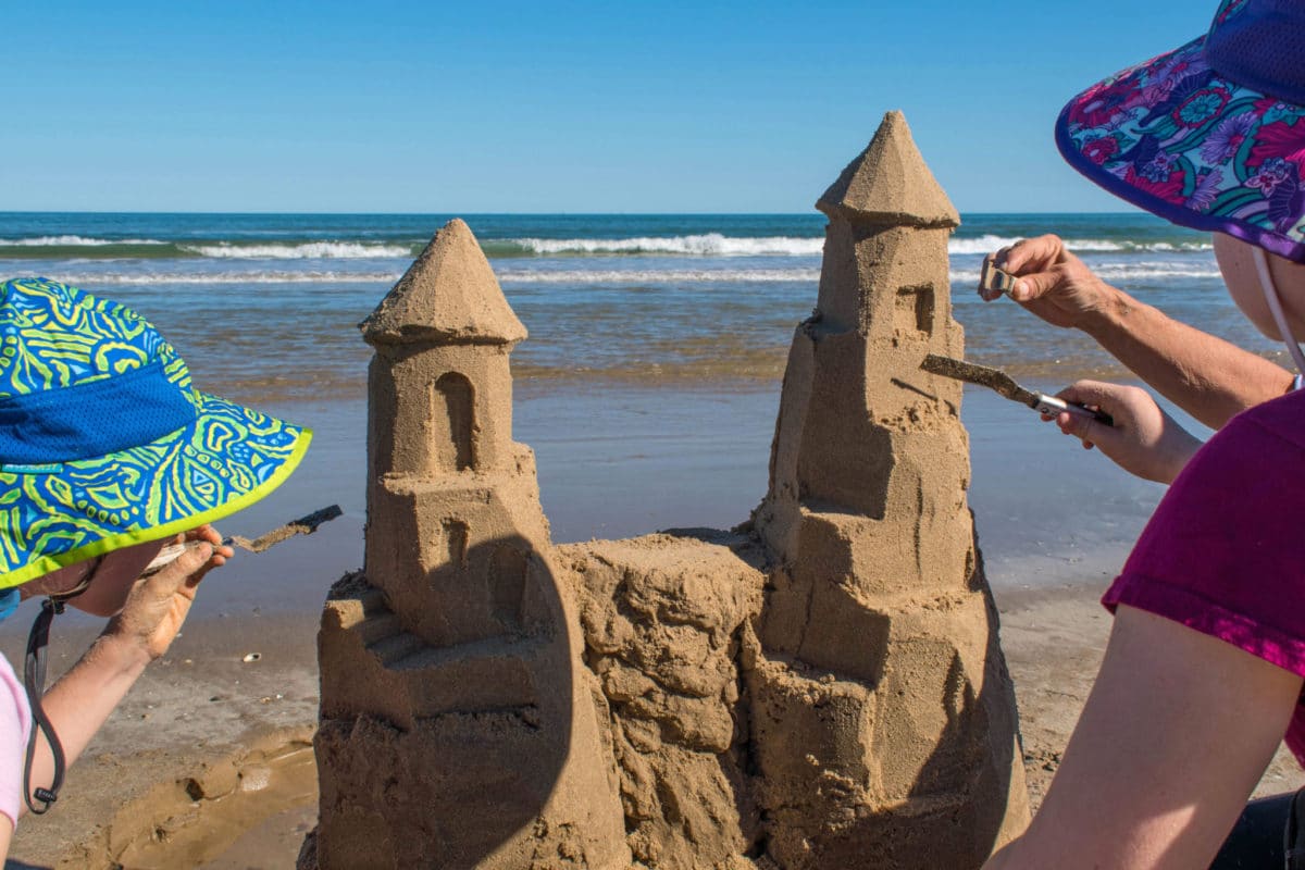 Carving windows and doors in the sandcastle