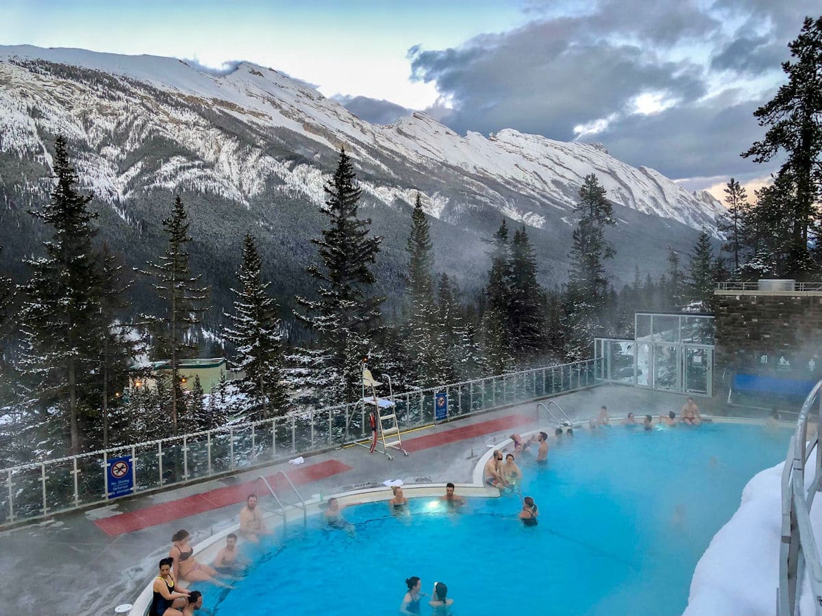 Soaking in Banff Upper Hot Springs, one of the amazing things to do in Banff in winter
