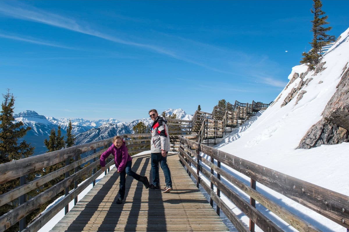 Having fun on Sulphur Mountain Boardwalk, one of the most amazing things to do in Banff in winter