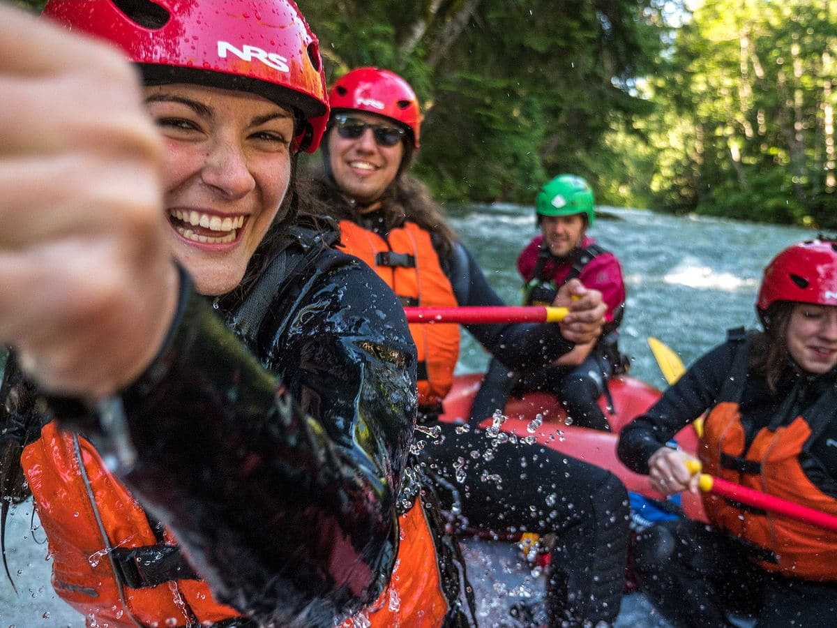 Young people white water rafting in Whistler, Canada