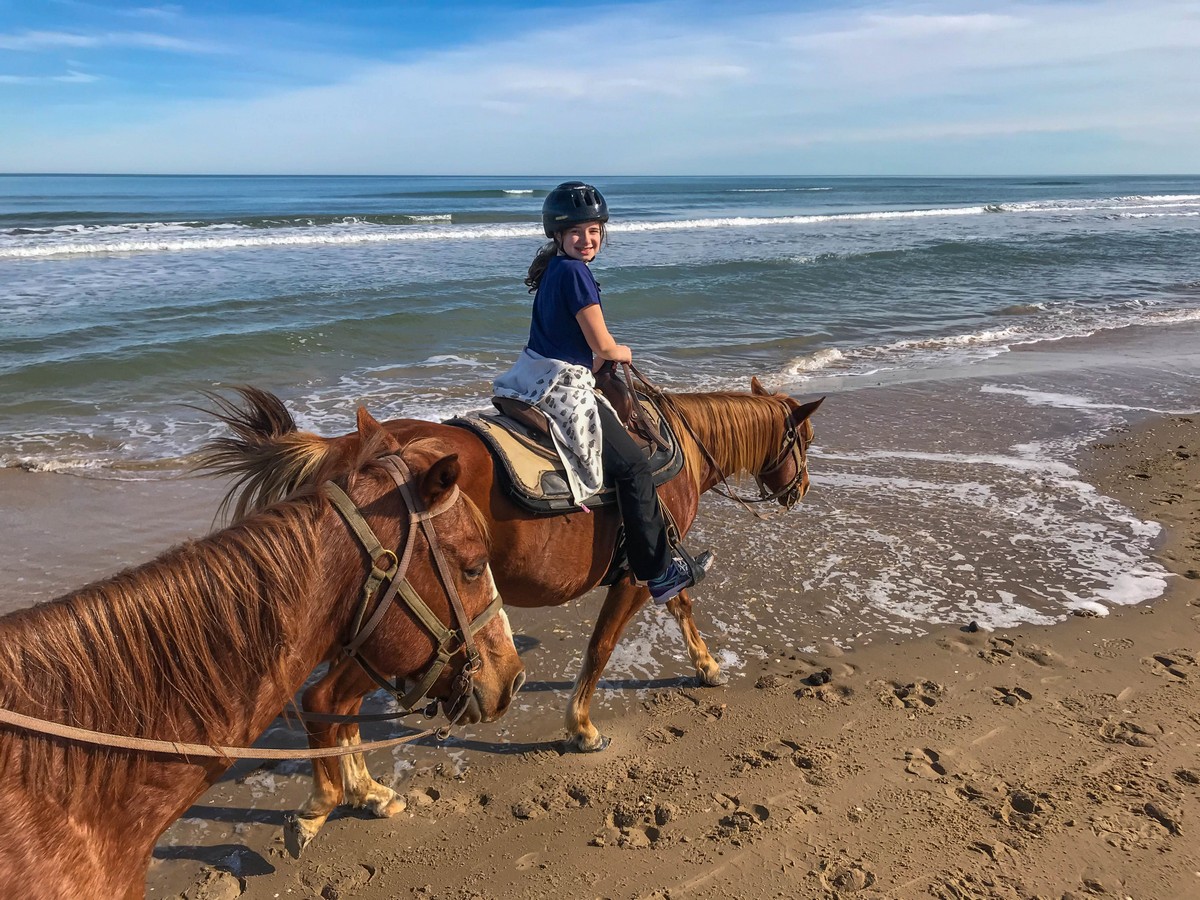 On the beach, riding a horse in South Padre Island