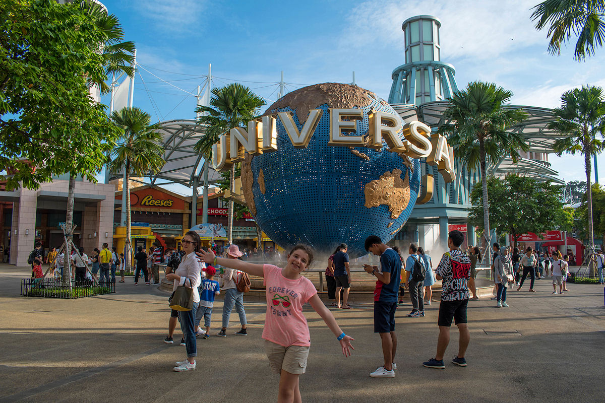 Posing with the Universal Studios Globe on Sentosa Island in Singapore