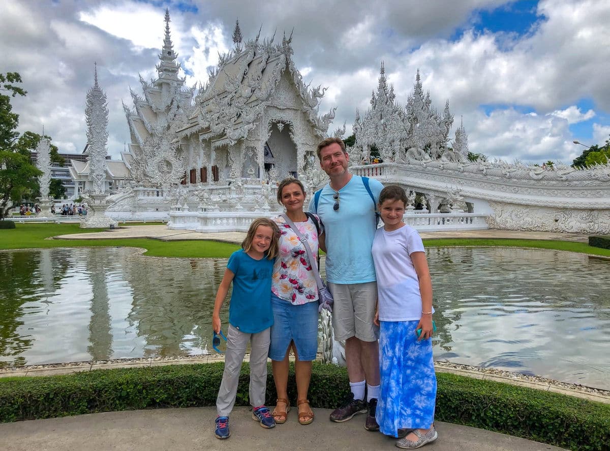 Family photo in front of the White Temple in Thailand