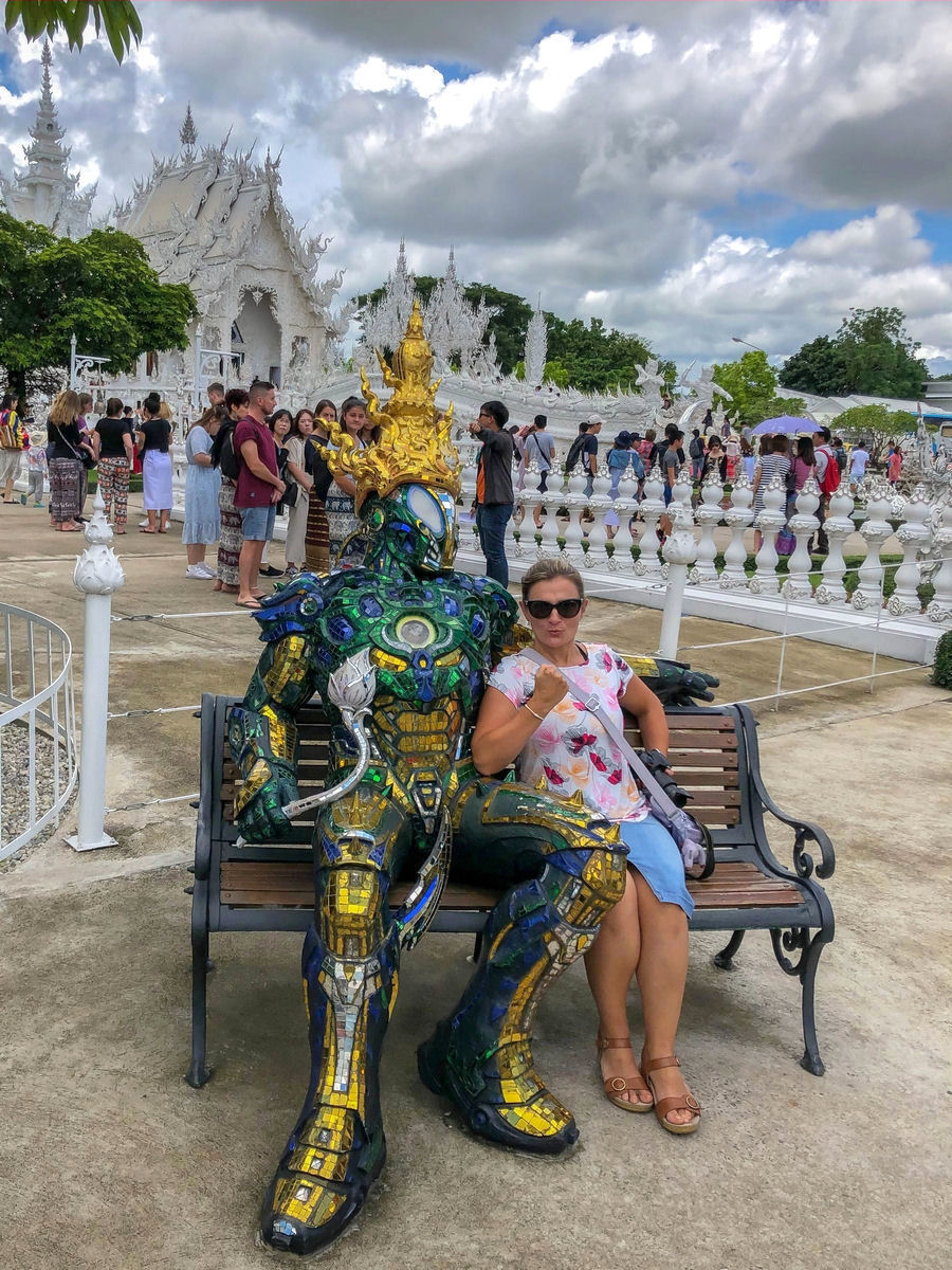 Mystery superhero on a bench at the White Temple