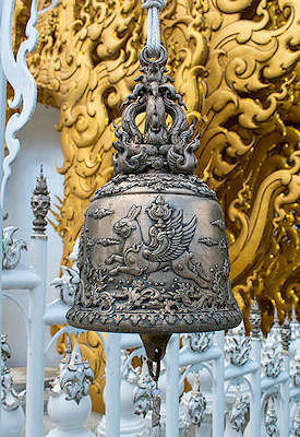 An ornate temple bell at the entrance of the White Temple