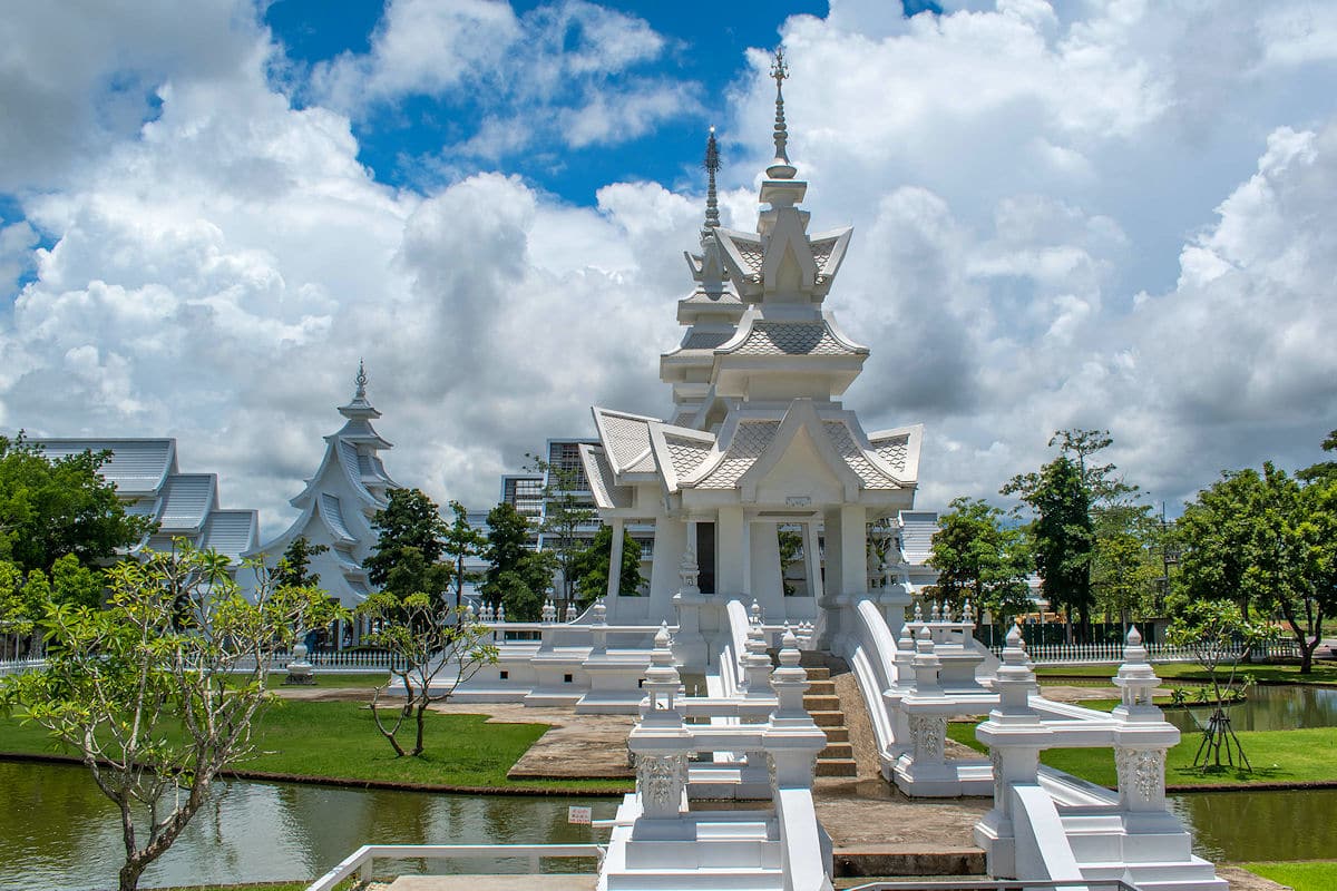 View of pagodas behind the White Temple in Thailand