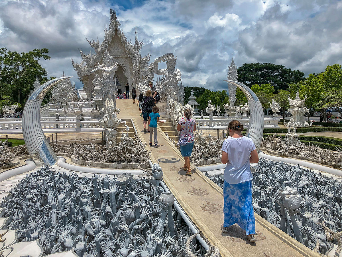 Strolling on the Bridge of the Cycle of Rebirth at the White Temple in Chiang Rai