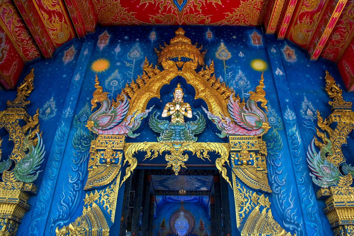 Beautiful art around the entrance of The Blue Temple in Chiang Rai