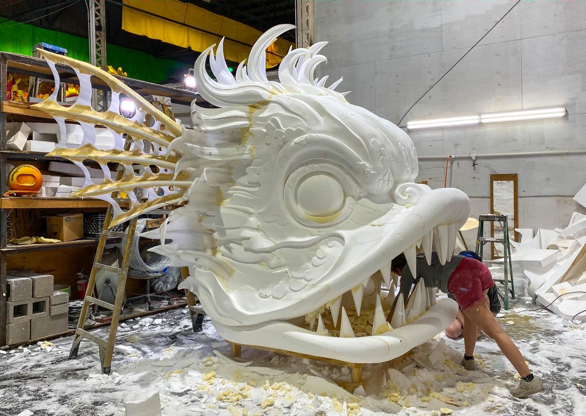 Artist working on giant fish at Mardi Gras World, New Orleans