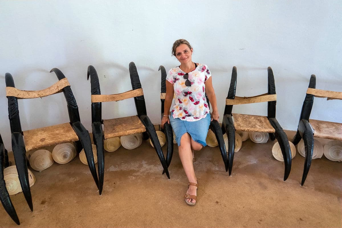 Sitting on a chair made of water buffalo horns and leather at Baan Dam Museum in Chiang Rai