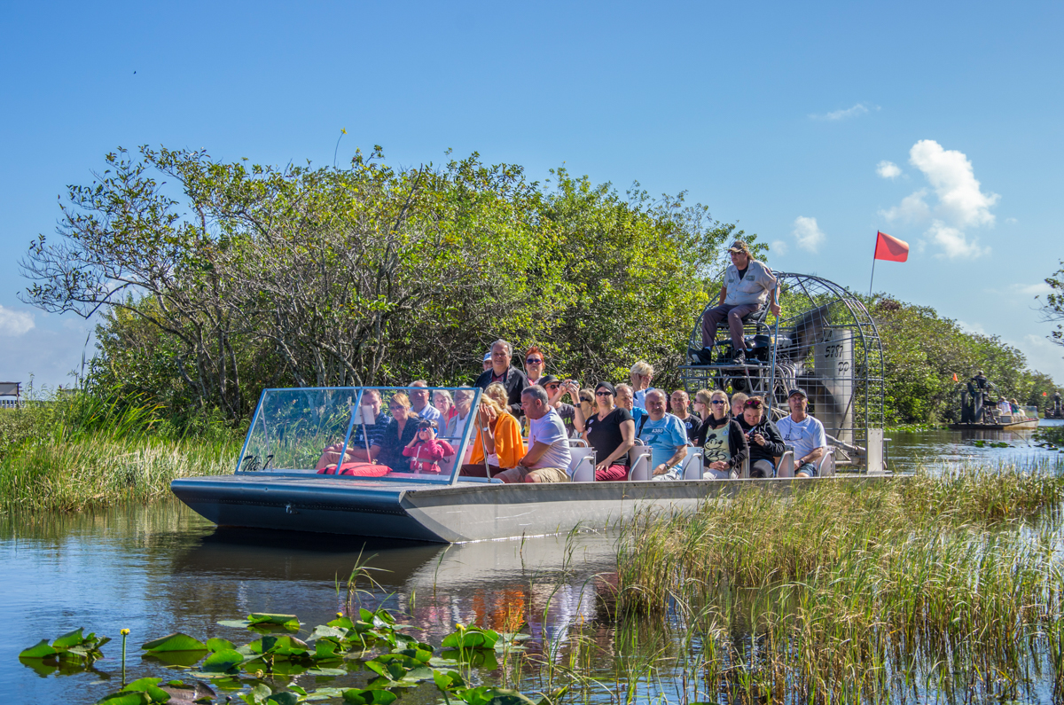 Air boat carrying tourists through the swamp