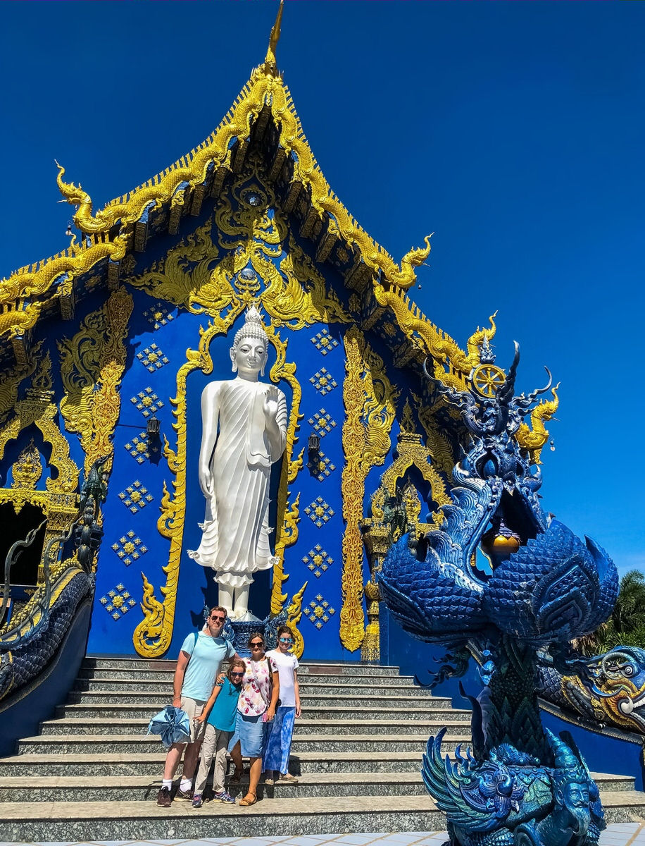 Family photo at the back of The Blue Temple in Chiang Rai, Thailand