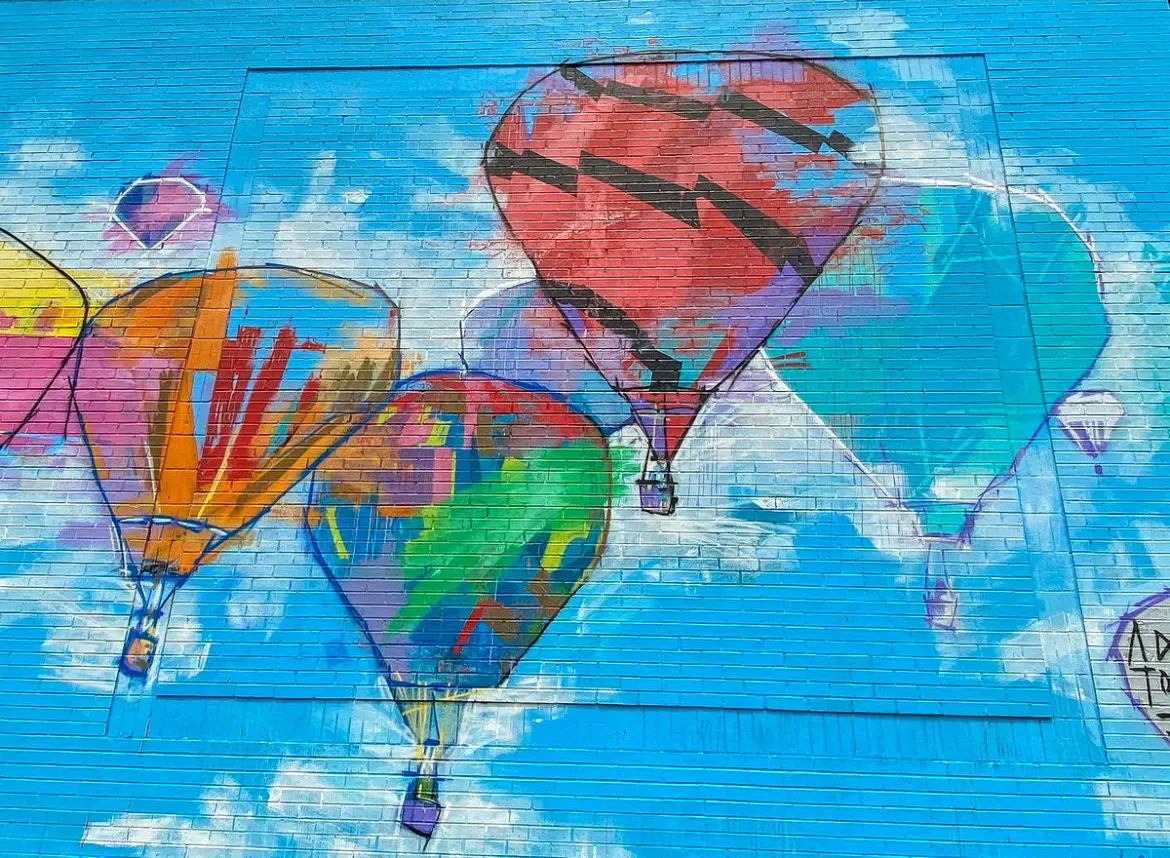 A mural of hot air balloons by Adrian Torres at Legacy Central in Plano