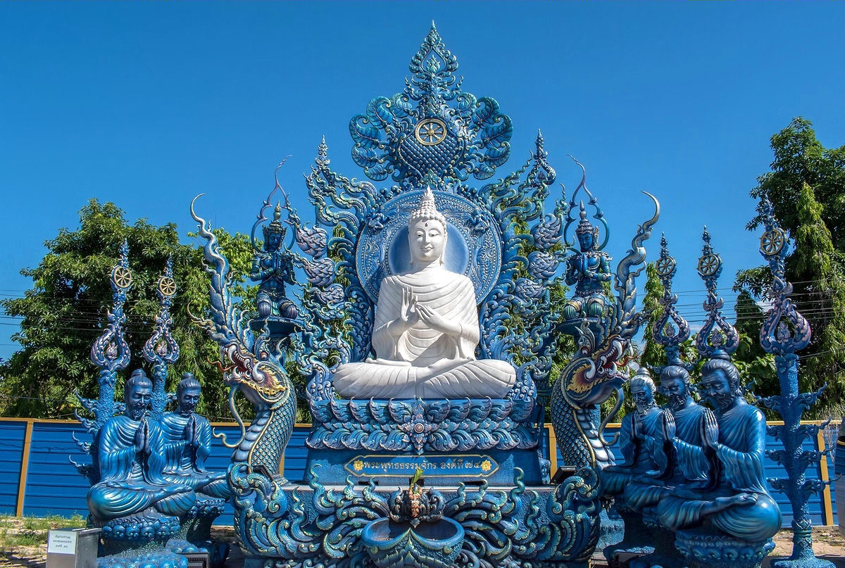 White Buddha statue near The Blue Temple in Chiang Rai, Thailand